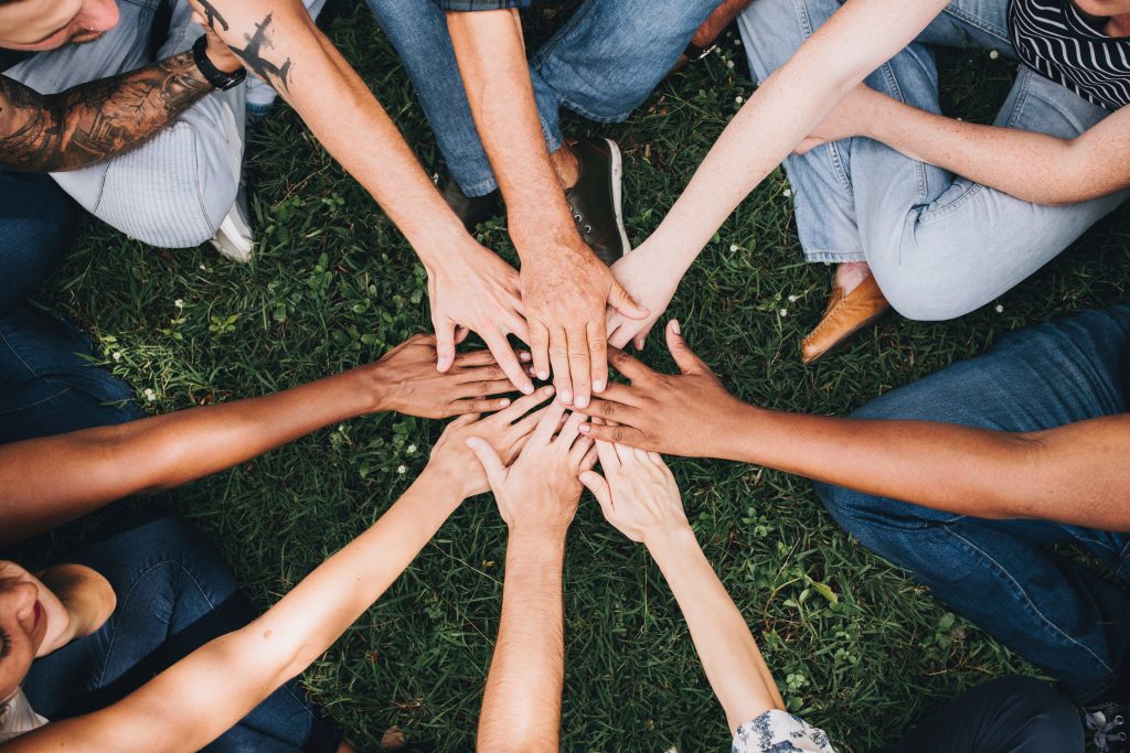 Group of people with hands together