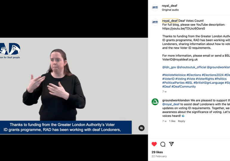 A still from a video of a woman delivering voter information in British Sign Language.